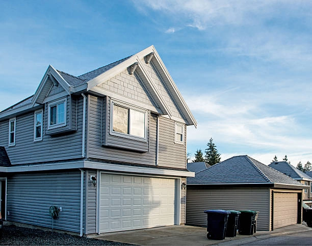 grey split level house with blue sky -split level home remodel