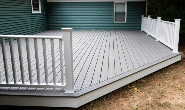 Spacious outdoor deck with white railing, enhancing backyard living space. -composite decking