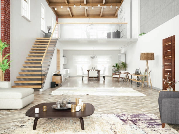 Modern open-concept loft with stylish decor, wooden stairs, and lighting. -Lgeneral construction duties