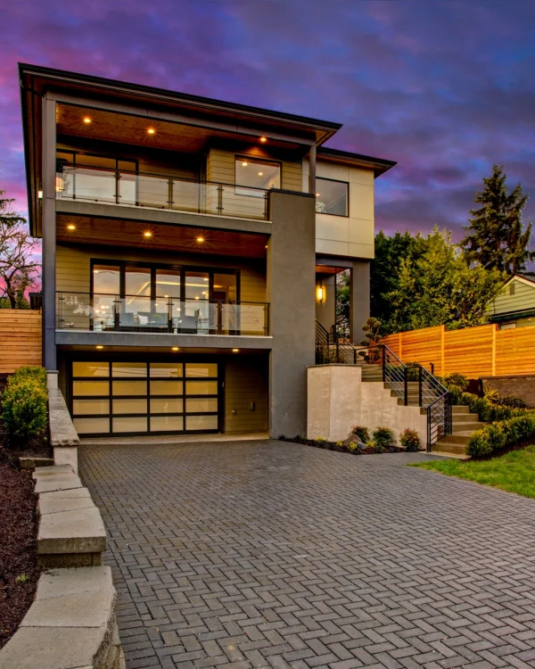 Luxury modern home exterior at sunset. Luxury modern home exterior at sunset.